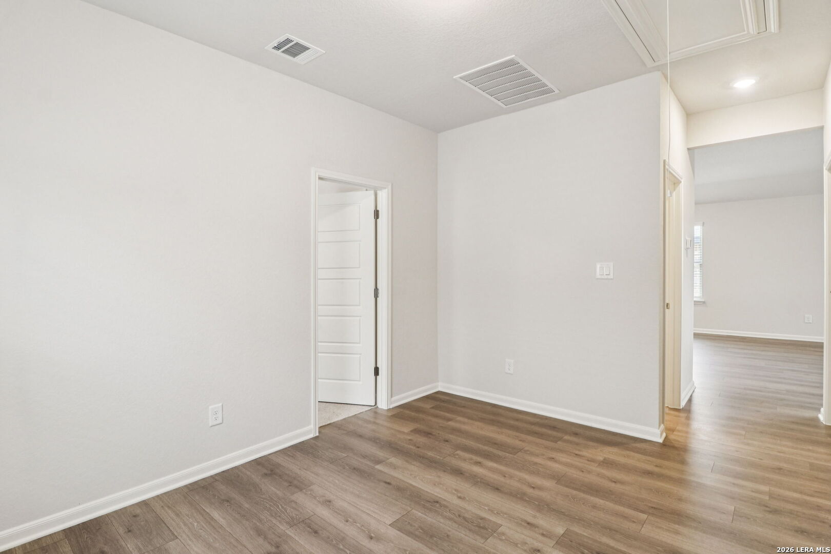 9909 Paladin Ridge San Antonio, TX 78254 - Photo 29 of 41 a view of an empty room with wooden floor