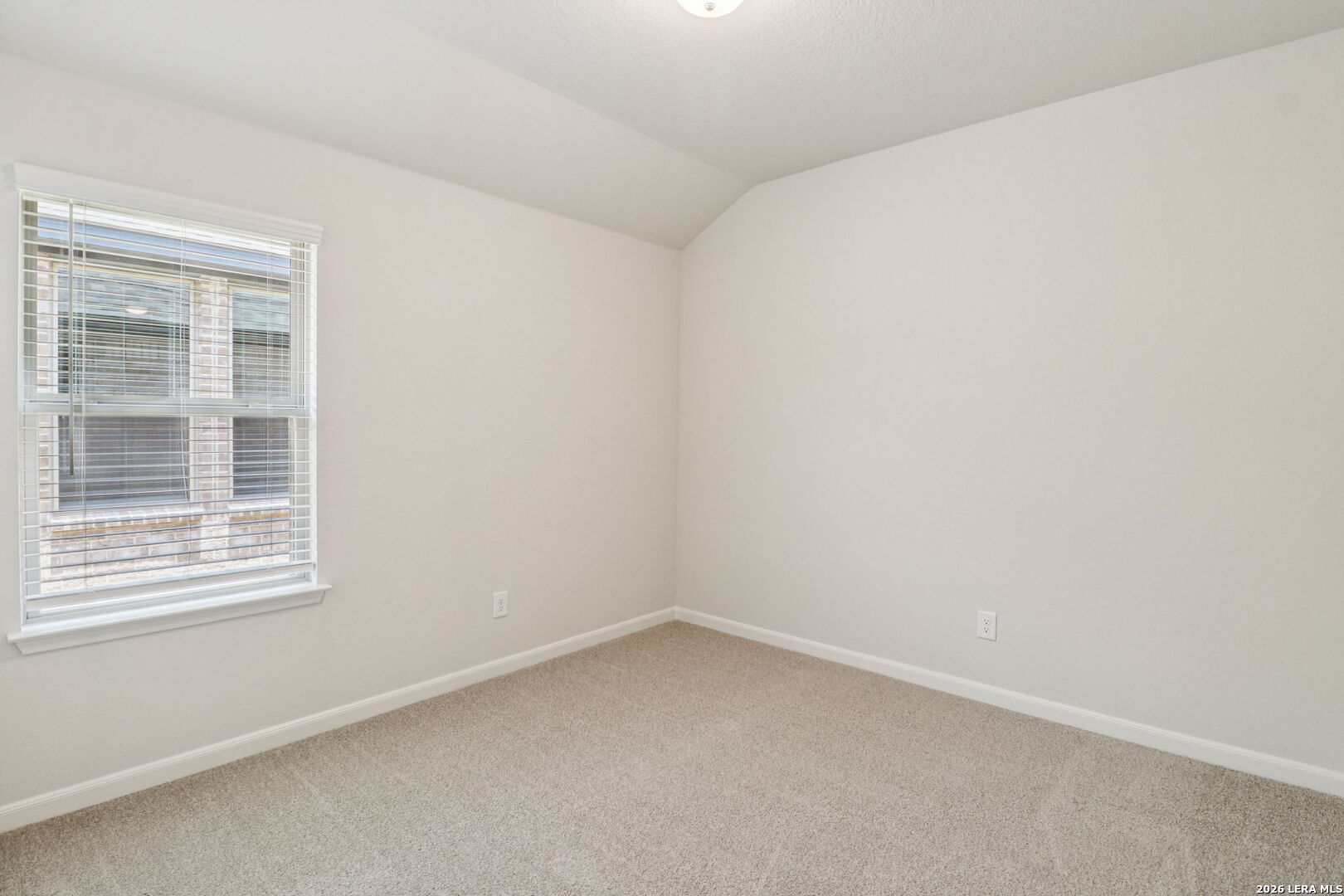 9909 Paladin Ridge San Antonio, TX 78254 - Photo 30 of 41 an empty room with a window