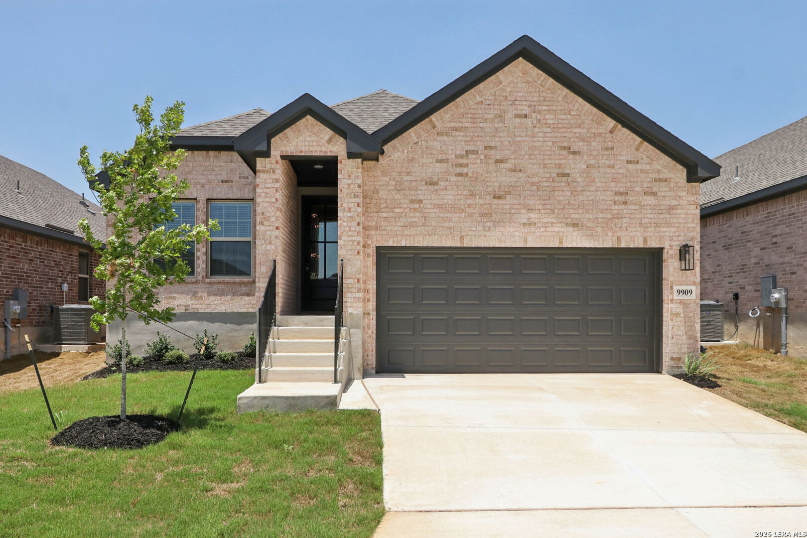 9909 Paladin Ridge San Antonio, TX 78254 - Photo 3 of 41 a front view of a house with a yard