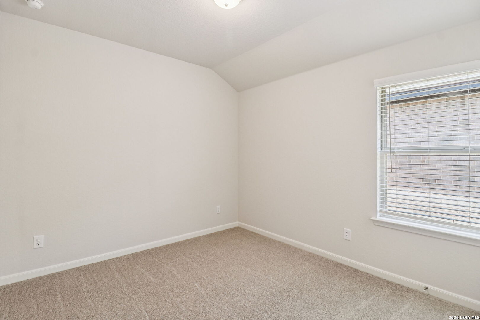 9909 Paladin Ridge San Antonio, TX 78254 - Photo 32 of 41 an empty room with a window