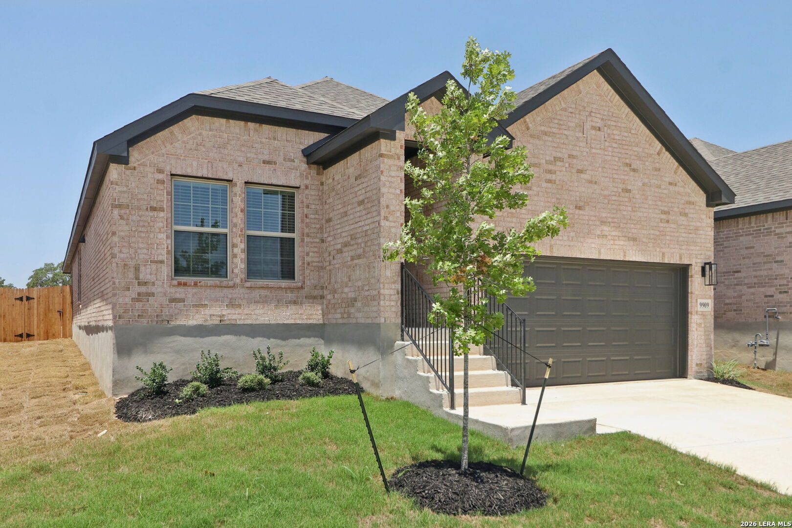 9909 Paladin Ridge San Antonio, TX 78254 - Photo 4 of 41 a front view of a house with garden