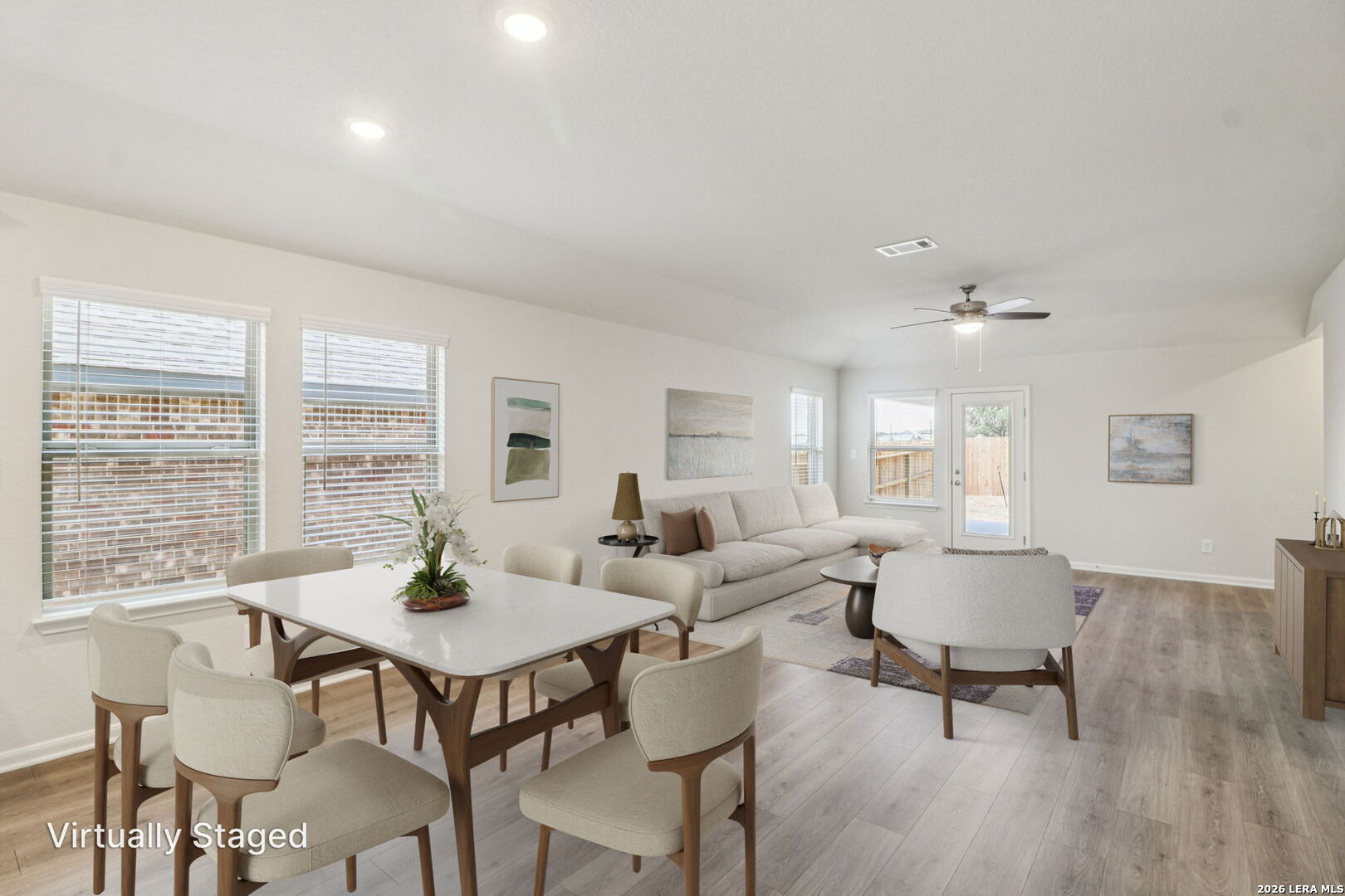 9909 Paladin Ridge San Antonio, TX 78254 - Photo 6 of 41 a view of a dining room with furniture and wooden floor