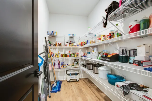 a spacious bathroom with a double vanity sink and a mirror
