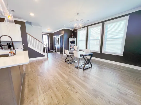 a large kitchen with stainless steel appliances kitchen island granite countertop a large counter top and stove top oven