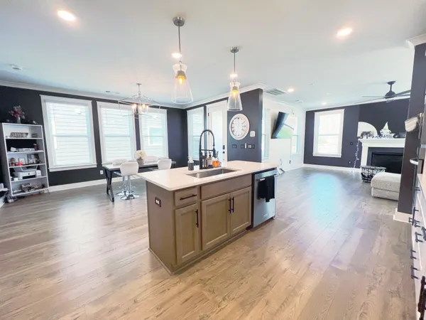 a living room with furniture fireplace and flat screen tv