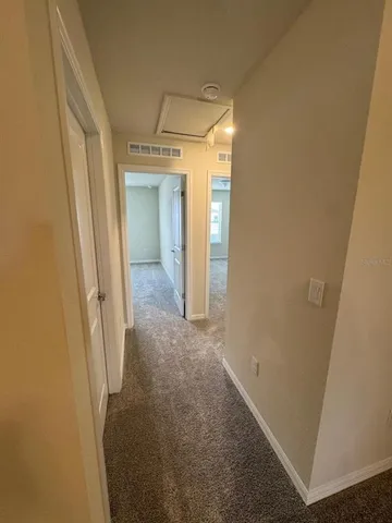 an empty room with a mirror