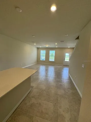 a kitchen with stainless steel appliances a refrigerator sink and microwave