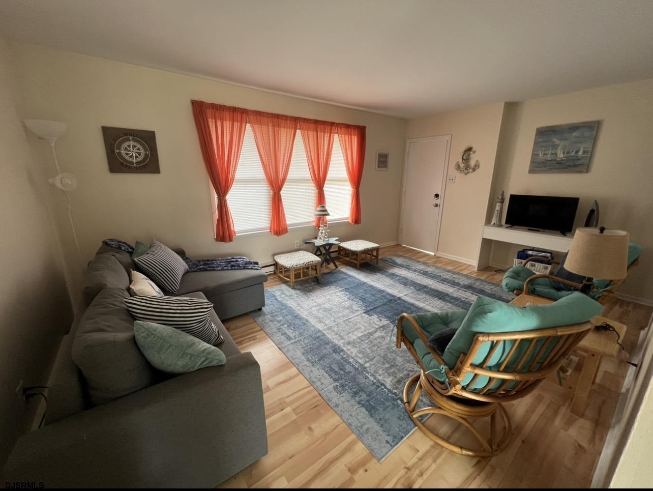 215 2nd Street North, Unit 1 Brigantine, NJ 08203 - Photo 5 of 24 a workspace with furniture and a large window