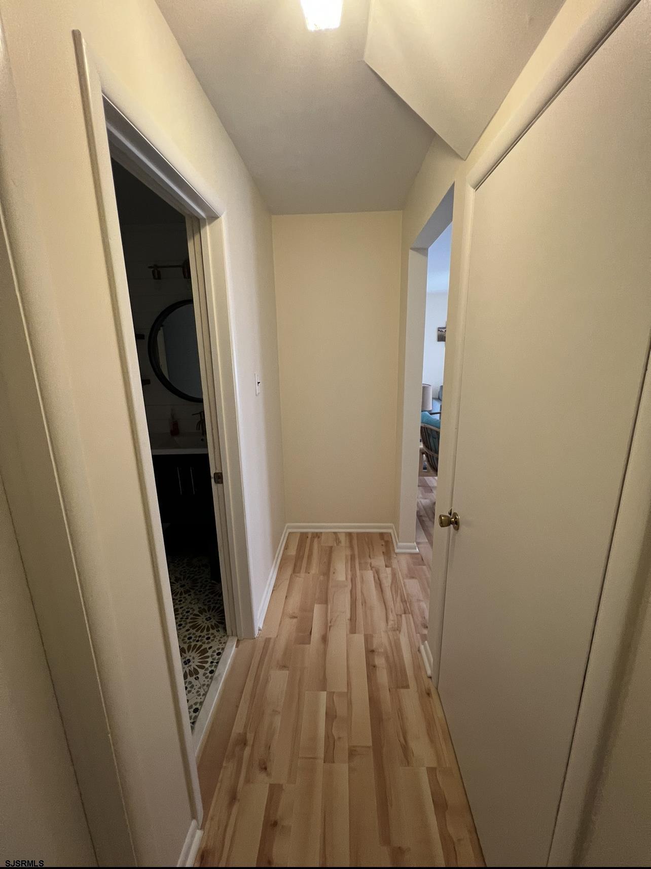 215 2nd Street North, Unit 1 Brigantine, NJ 08203 - Photo 10 of 24 a view of wooden floor in a bathroom