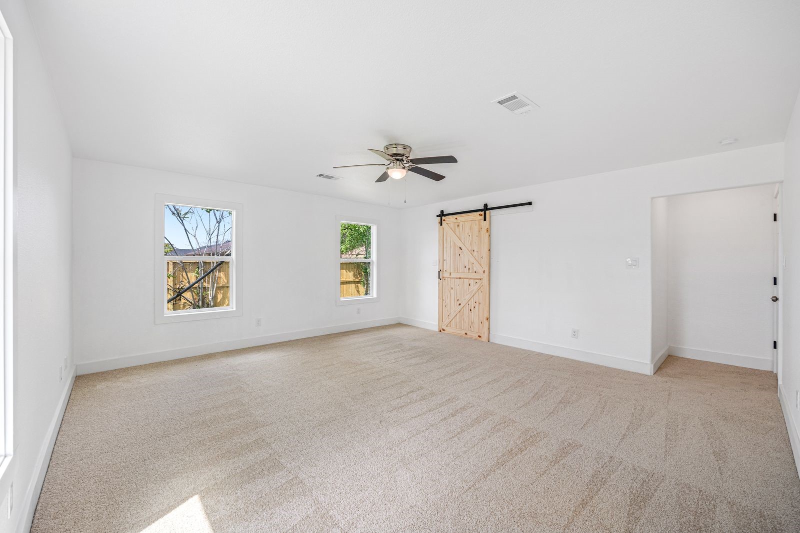 1214 Main Street Alvin, TX 77511 - Photo 10 of 26 a view of an empty room with a window
