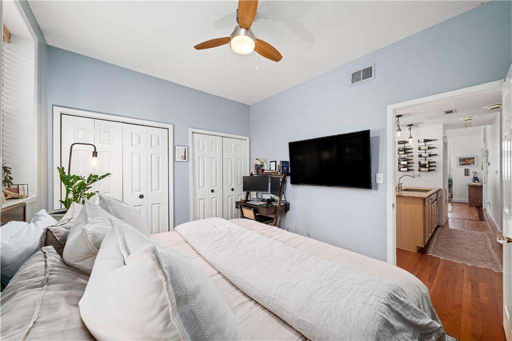 1116 Piedmont Avenue Northeast, Unit 10 Atlanta, GA 30309 - Photo 22 of 59 a bedroom with a large bed and a flat screen tv