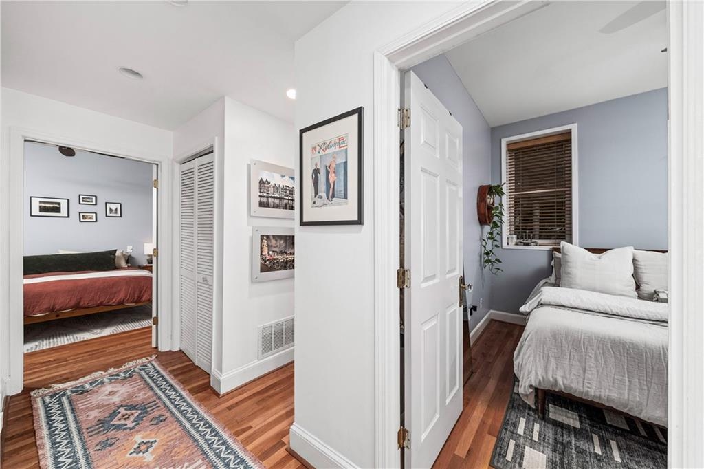 1116 Piedmont Avenue Northeast, Unit 10 Atlanta, GA 30309 - Photo 28 of 59 a bedroom with furniture and a rug