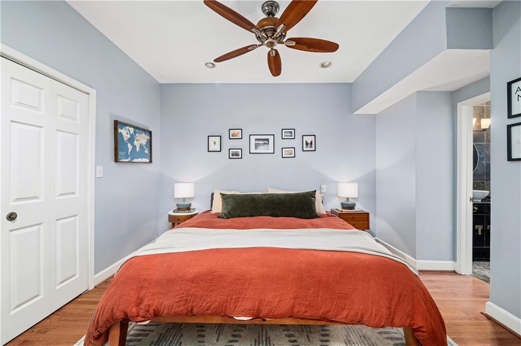 1116 Piedmont Avenue Northeast, Unit 10 Atlanta, GA 30309 - Photo 29 of 59 a bedroom with a bed and a chandelier