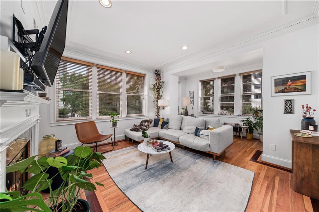1116 Piedmont Avenue Northeast, Unit 10 Atlanta, GA 30309 - Photo 4 of 59 a living room with furniture large window and flat screen tv