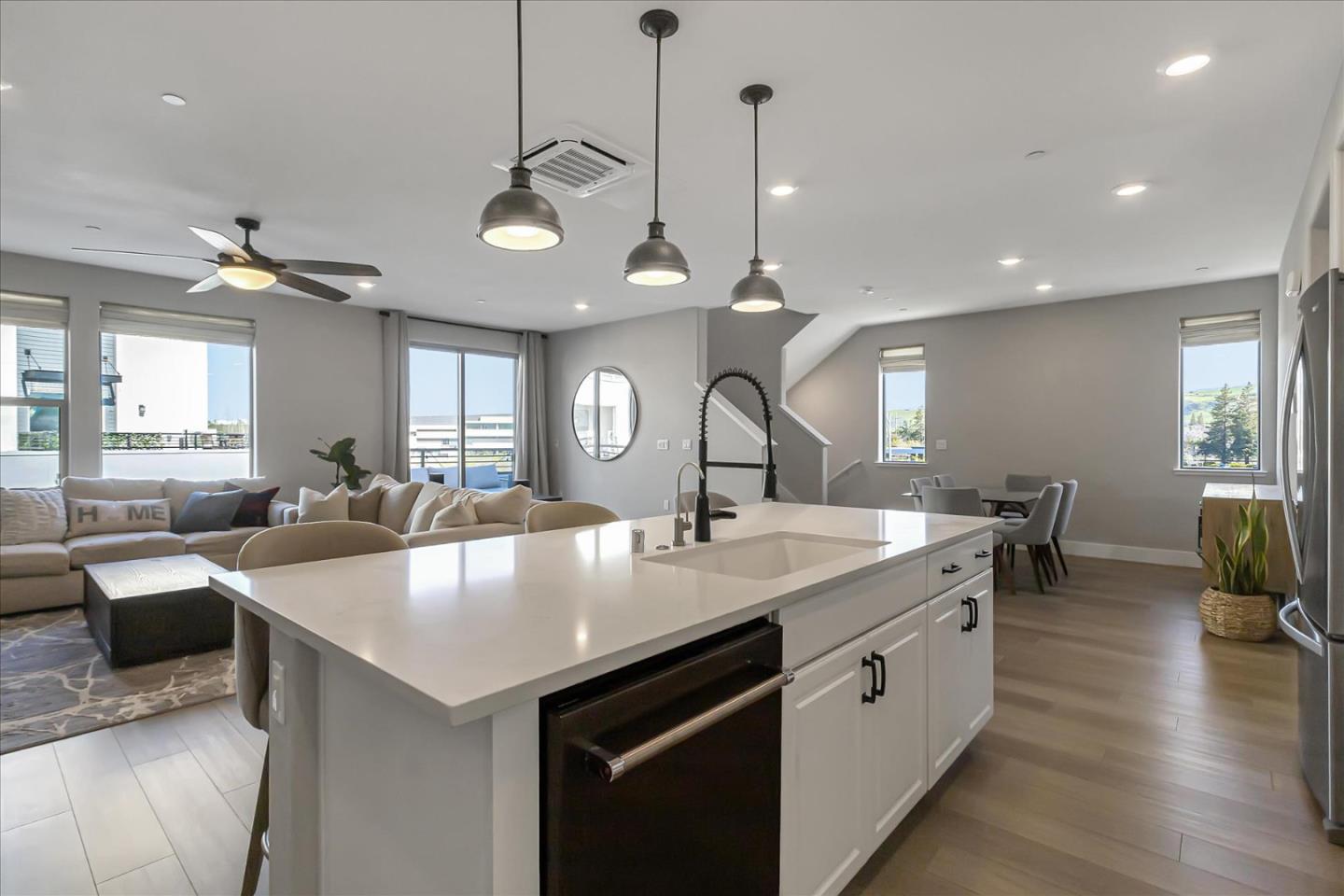 6823 Vector Court San Jose, CA 95119 - Photo 13 of 51 a large kitchen with lots of counter space a sink appliances and living room view