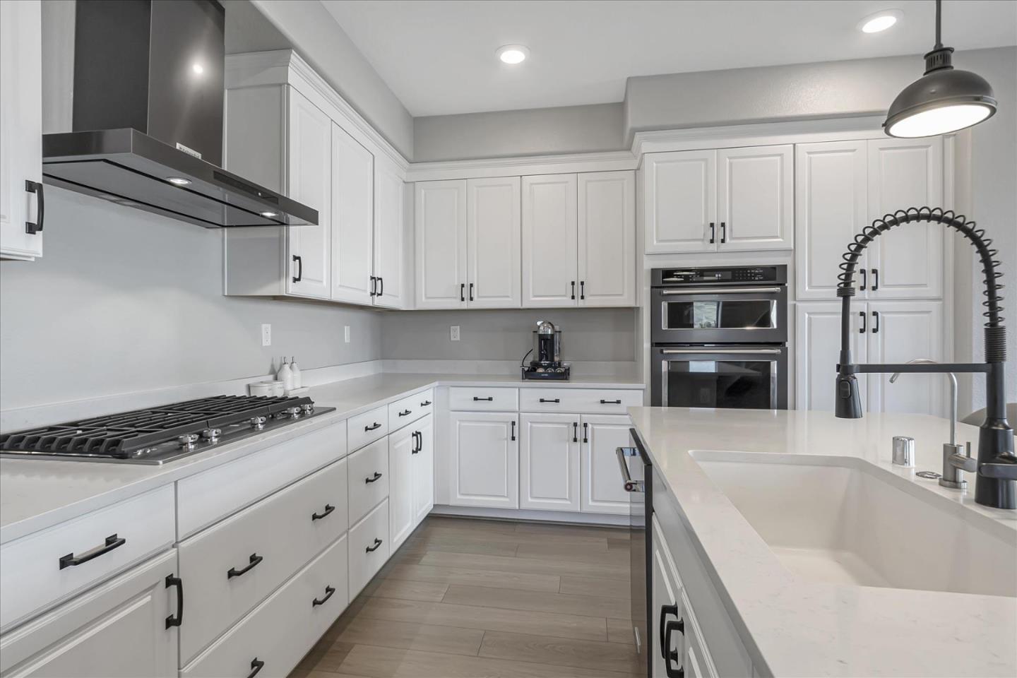 6823 Vector Court San Jose, CA 95119 - Photo 14 of 51 a kitchen with stainless steel appliances granite countertop a sink stove and cabinets