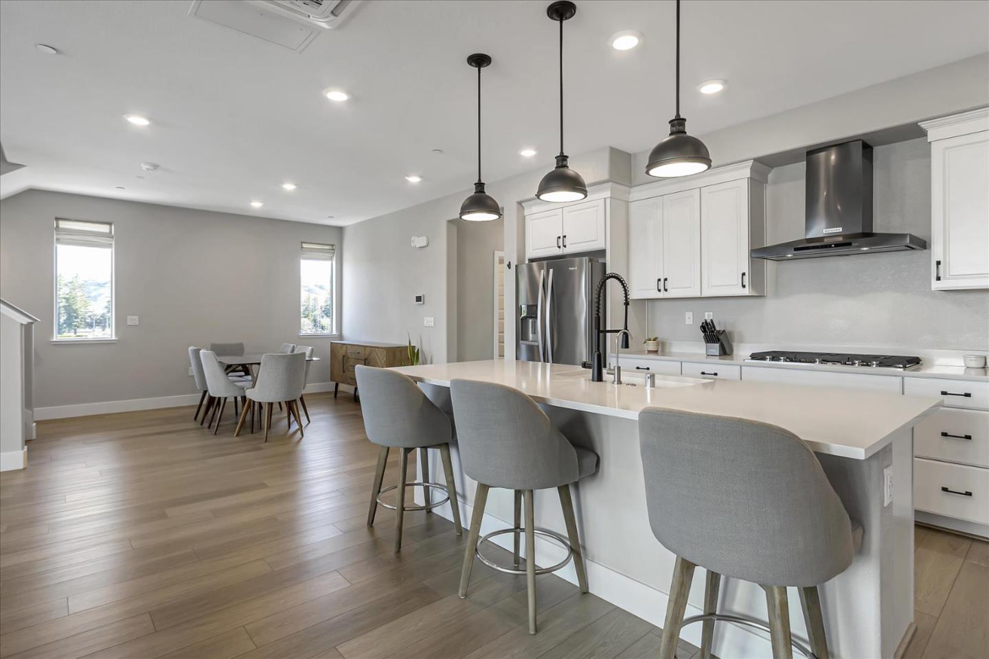6823 Vector Court San Jose, CA 95119 - Photo 15 of 51 a large kitchen with a table and chairs