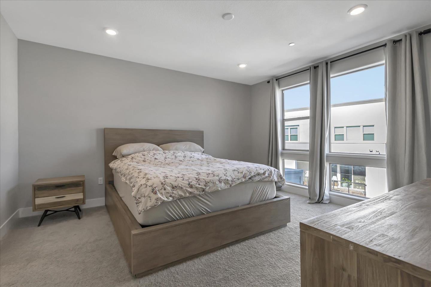 6823 Vector Court San Jose, CA 95119 - Photo 19 of 51 a bedroom with a bed and glass door