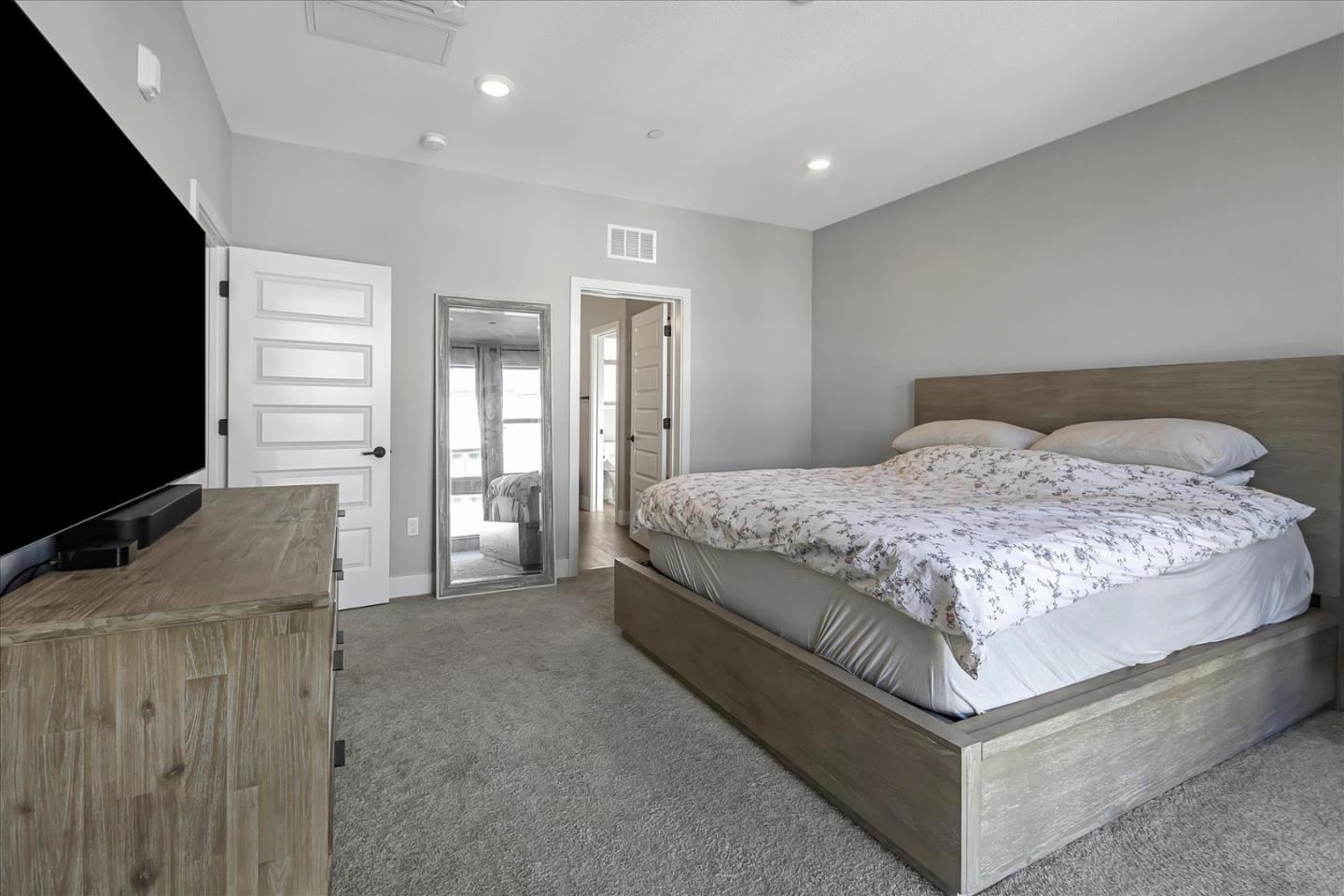 6823 Vector Court San Jose, CA 95119 - Photo 22 of 51 a bedroom with a large bed and a flat screen tv