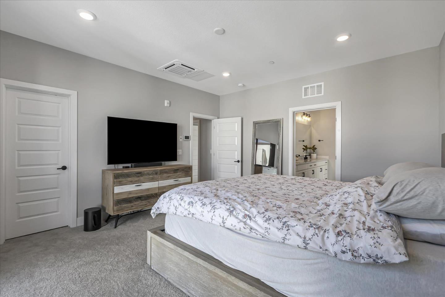 6823 Vector Court San Jose, CA 95119 - Photo 23 of 51 a bedroom with a bed and a flat screen tv