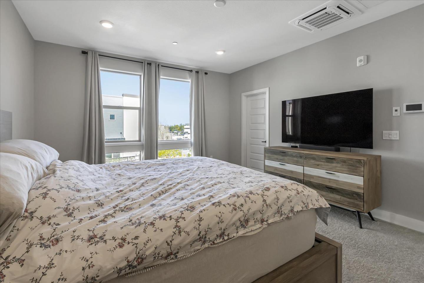 6823 Vector Court San Jose, CA 95119 - Photo 24 of 51 a bedroom with a bed and a flat screen tv