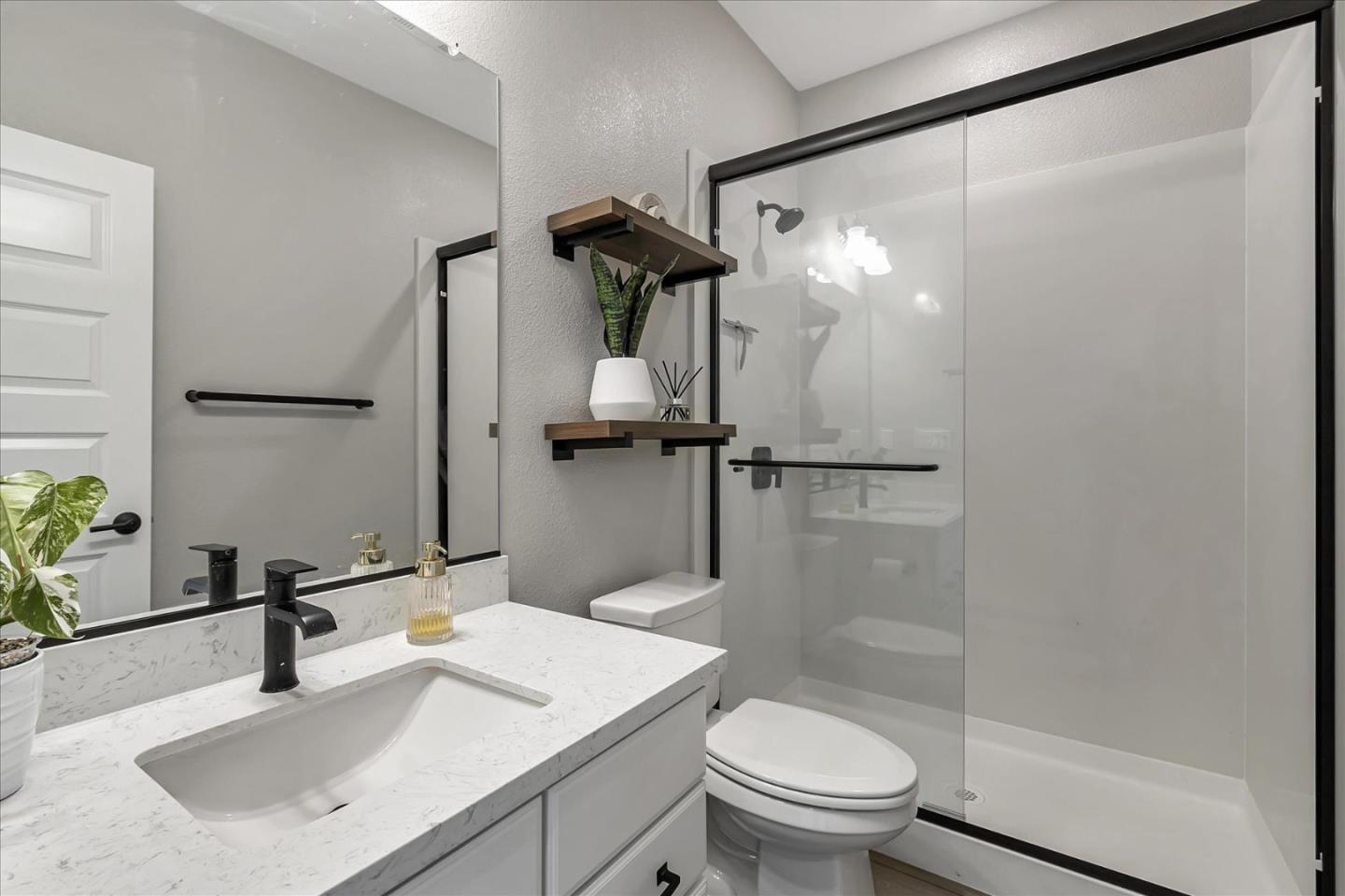 6823 Vector Court San Jose, CA 95119 - Photo 27 of 51 a bathroom with a sink toilet and shower
