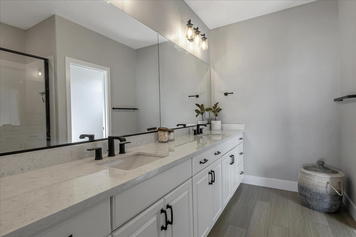 6823 Vector Court San Jose, CA 95119 - Photo 29 of 51 a bathroom with a double vanity sink and a mirror