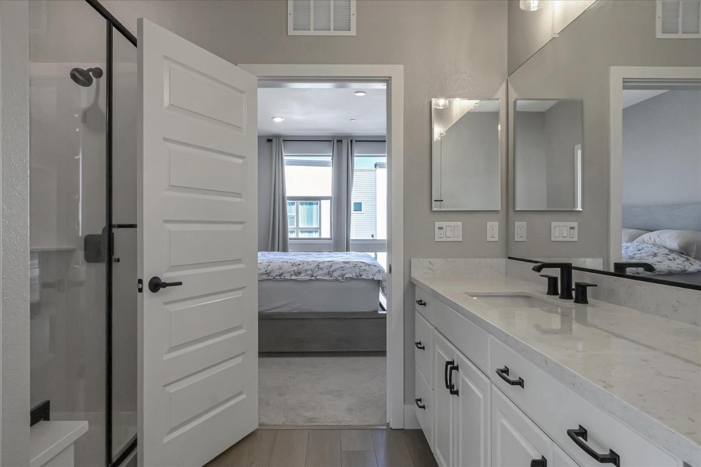 6823 Vector Court San Jose, CA 95119 - Photo 30 of 51 a bathroom with a granite countertop sink mirror and a bathtub