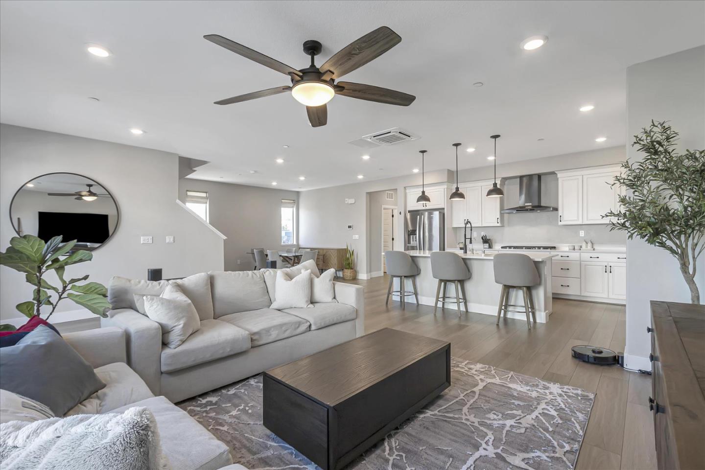 6823 Vector Court San Jose, CA 95119 - Photo 7 of 51 a living room with furniture kitchen view and a chandelier