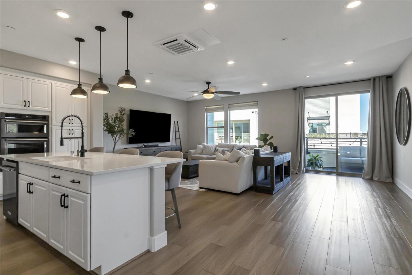 6823 Vector Court San Jose, CA 95119 - Photo 9 of 51 a large white kitchen with a large window