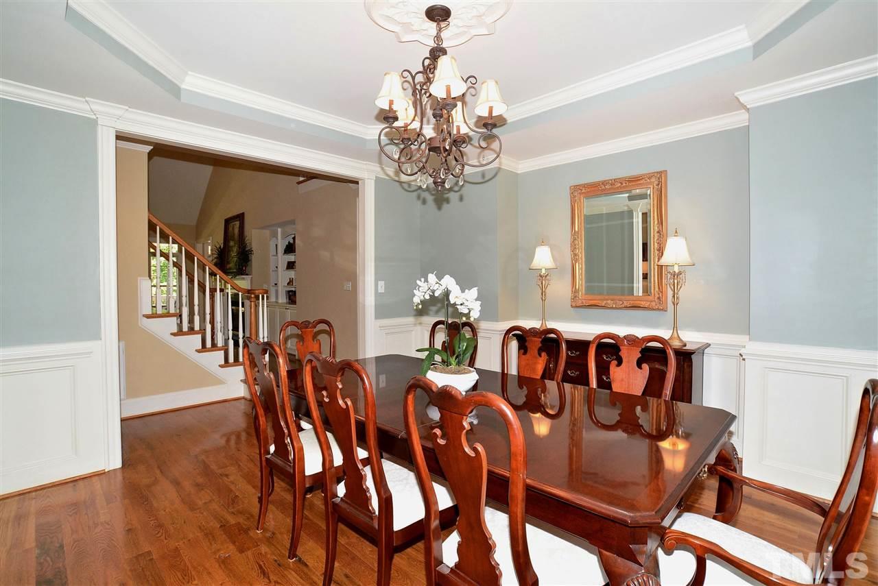 1089 Tacketts Pond Drive Raleigh, NC 27614 - Photo 7 of 30 Spacious Dining Room with Trey Ceiling, Extensive Molding & Wainscoting. Butler Pantry (not shown) has Granite Counter & Mullion Glass Cabinet Doors.