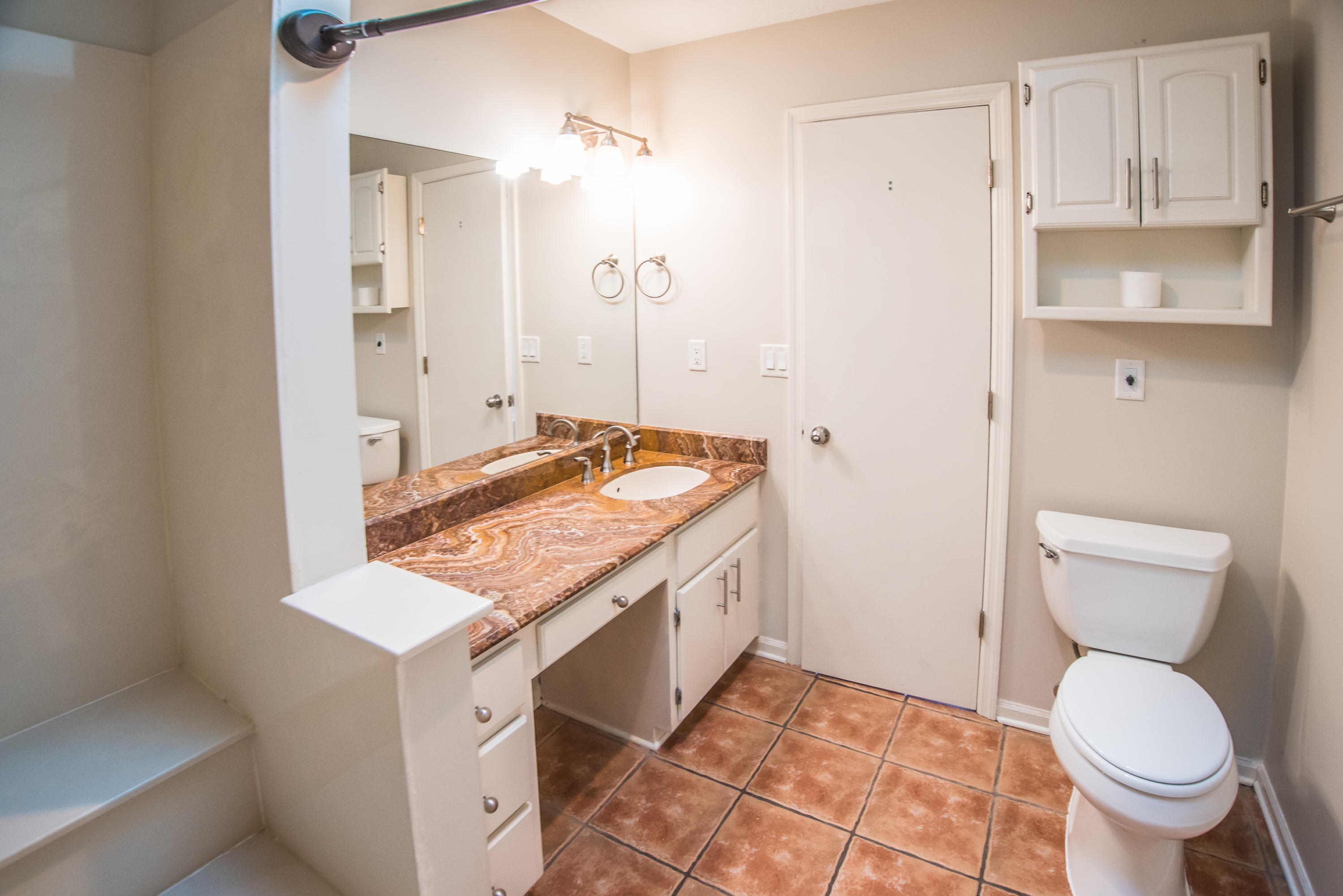 52 Rue D Honfleur Destin, FL 32541 - Photo 12 of 22 a spacious bathroom with a granite countertop toilet and a sink