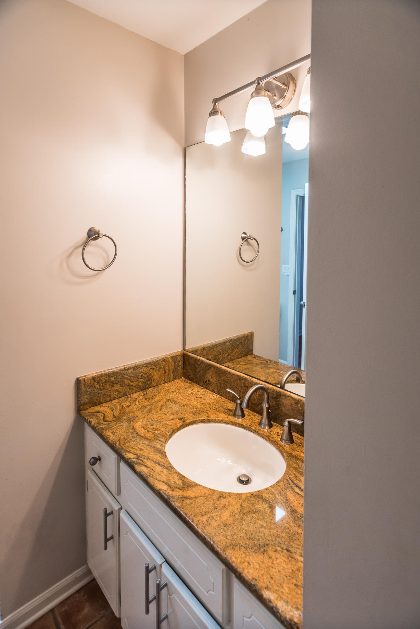 52 Rue D Honfleur Destin, FL 32541 - Photo 15 of 22 a bathroom with a granite countertop sink and a mirror