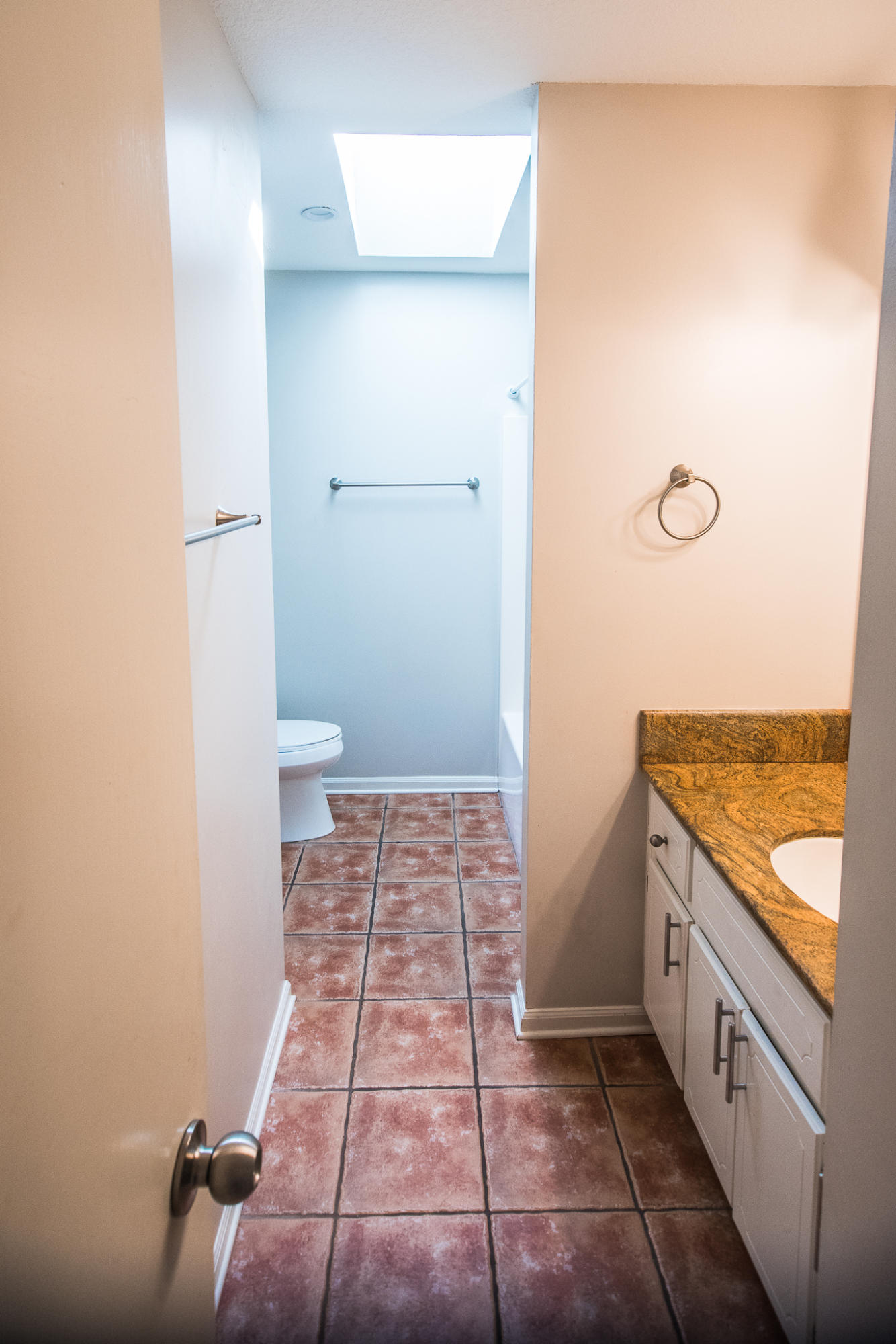 52 Rue D Honfleur Destin, FL 32541 - Photo 16 of 22 a bathroom with a granite countertop sink and a toilet