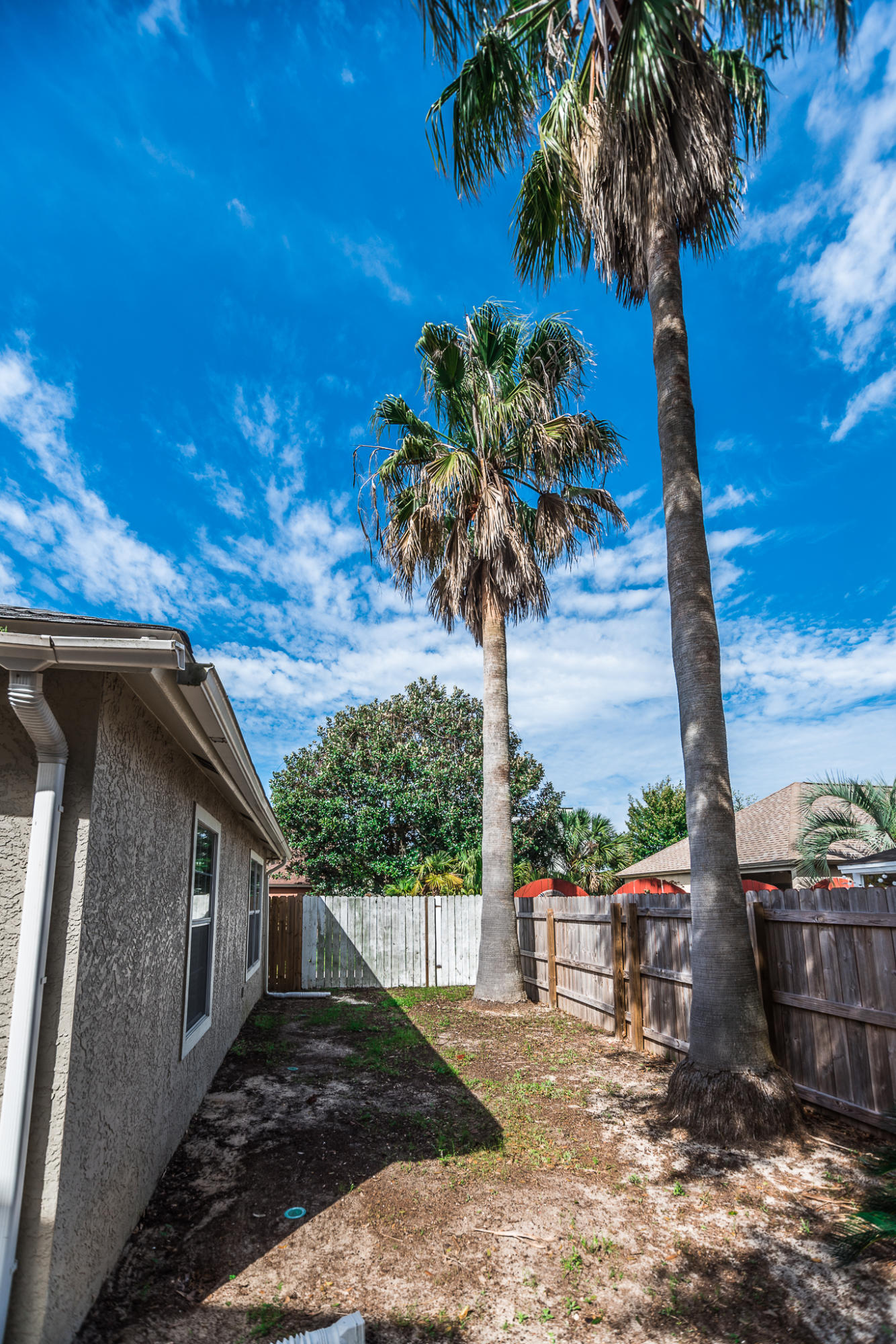 52 Rue D Honfleur Destin, FL 32541 - Photo 21 of 22 a view of a house with backyard and tree