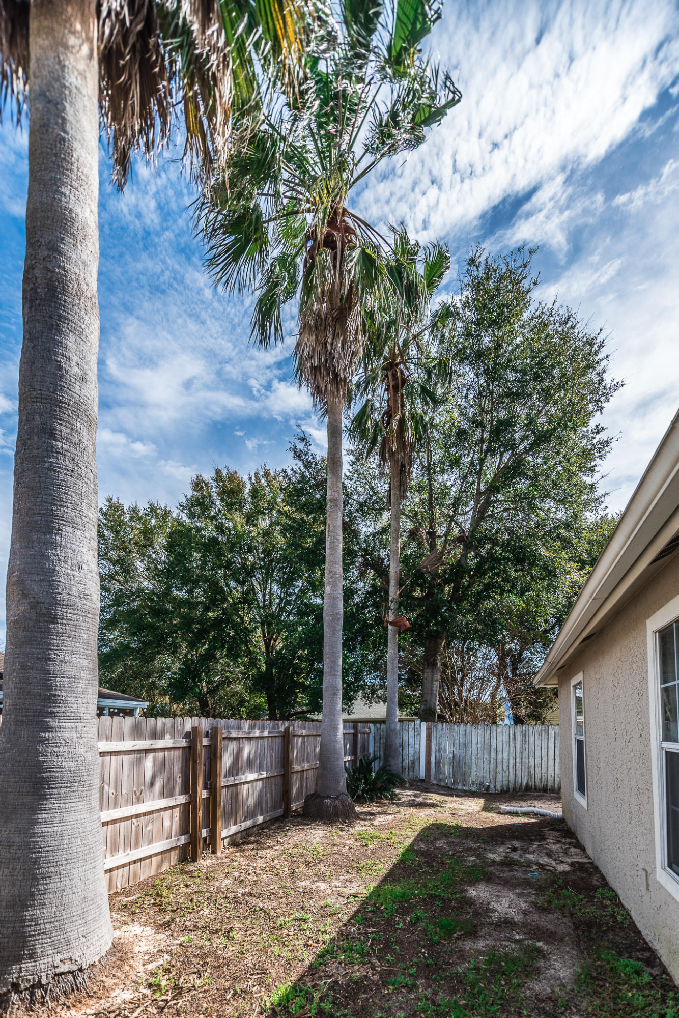 52 Rue D Honfleur Destin, FL 32541 - Photo 22 of 22 a backyard of a house with lots of green space