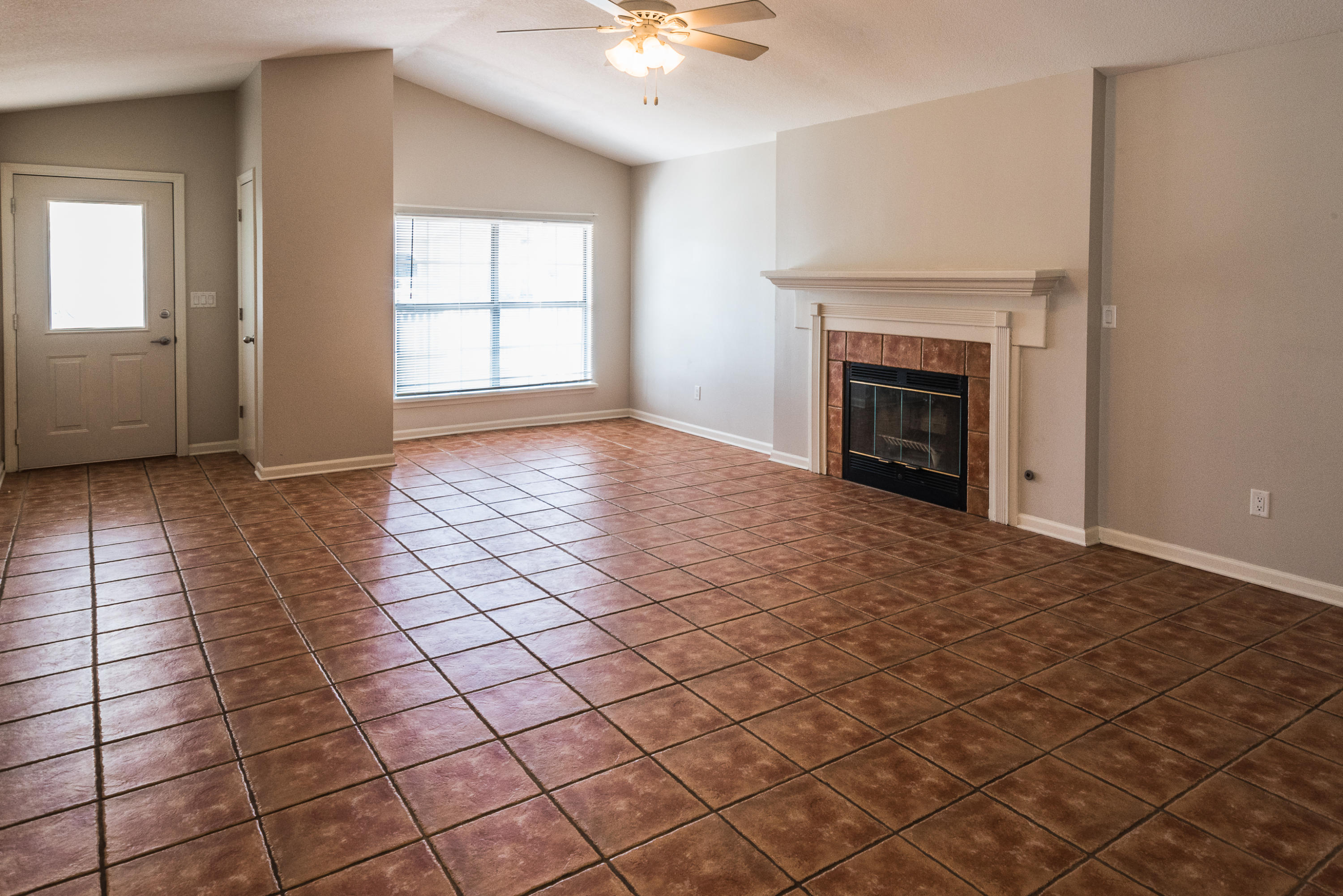 52 Rue D Honfleur Destin, FL 32541 - Photo 4 of 22 an empty room with windows and a fireplace