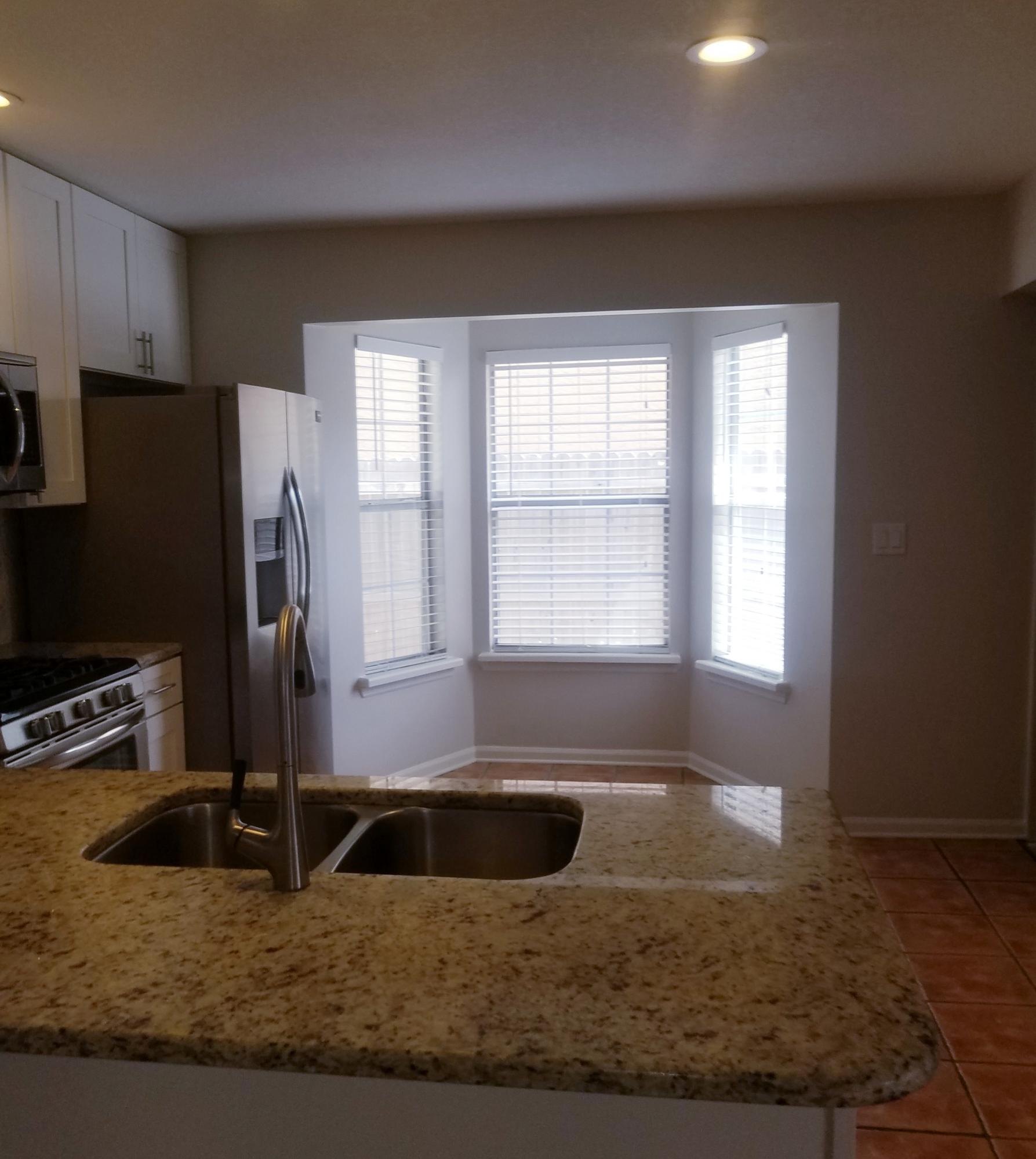 52 Rue D Honfleur Destin, FL 32541 - Photo 8 of 22 a kitchen with a sink a counter top space and cabinets