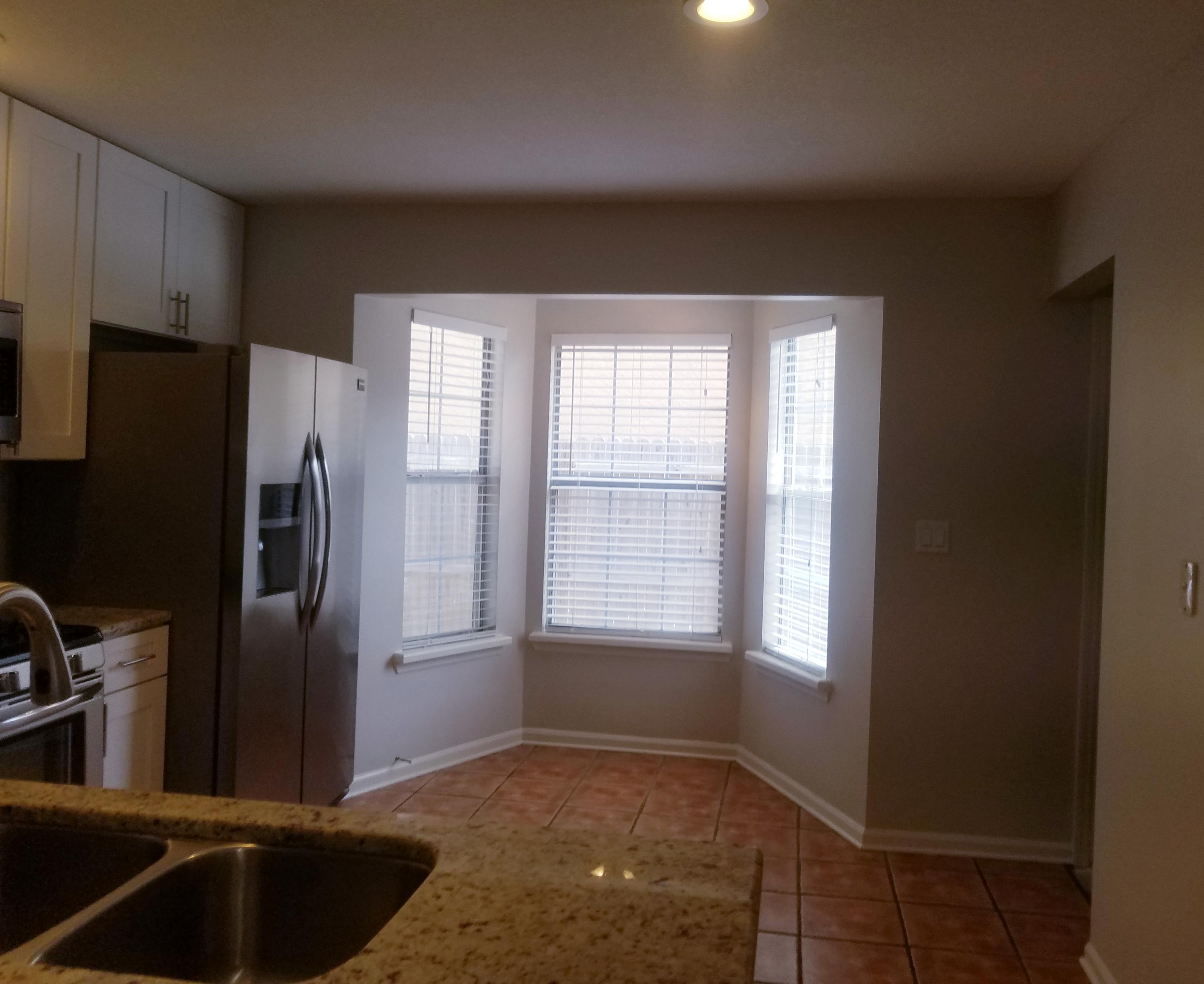 52 Rue D Honfleur Destin, FL 32541 - Photo 9 of 22 a view of a refrigerator in kitchen and wooden floor