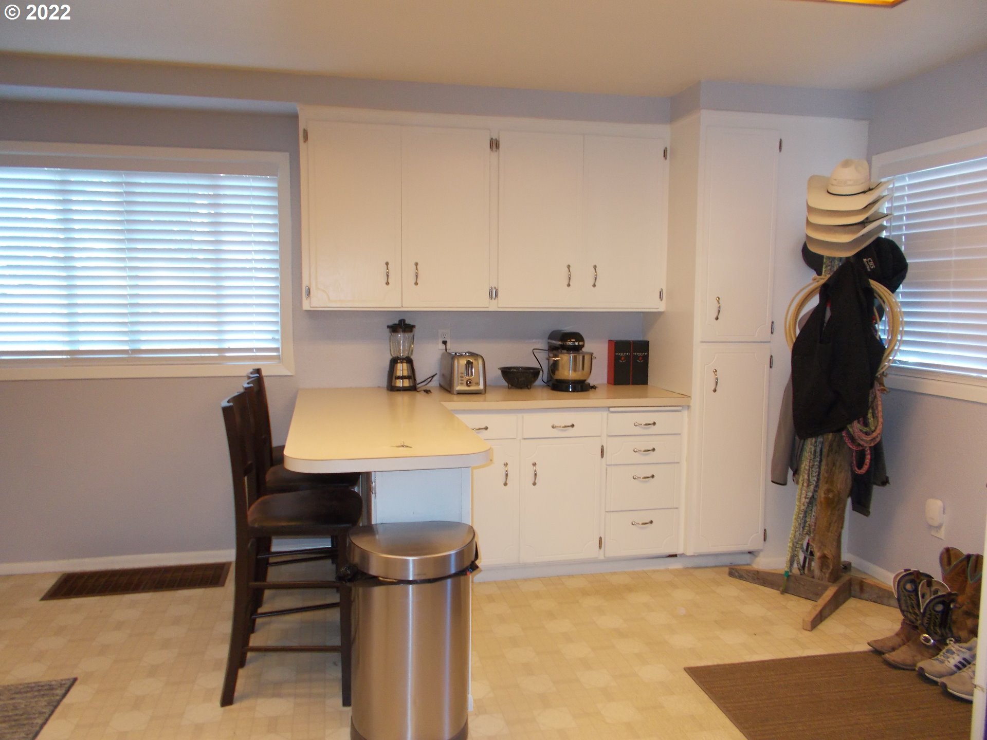 440 Main Street Athena, OR 97813 - Photo 4 of 18 a kitchen with a sink a stove a dining table and chairs