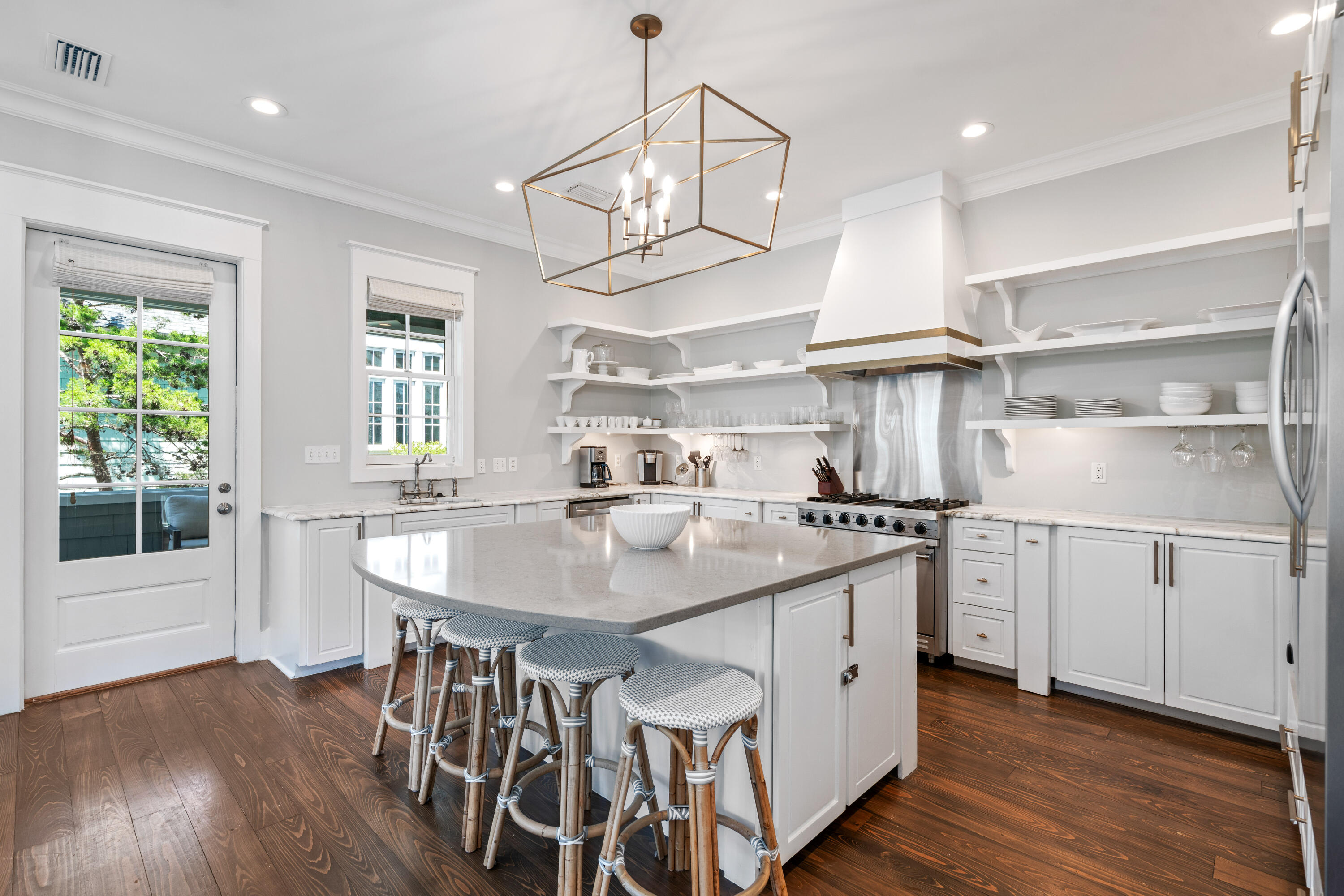 148 Coopersmith Lane Inlet Beach, FL 32461 - Photo 39 of 82 a kitchen with stainless steel appliances granite countertop a stove a sink dishwasher a dining table and chairs with wooden floor
