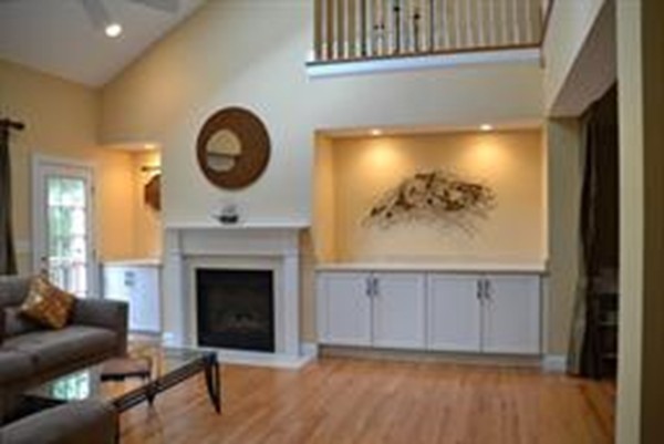 3 Indian Woods Way, Unit 3 Canton, MA 02021 - Photo 5 of 10 a living room with furniture and a fireplace