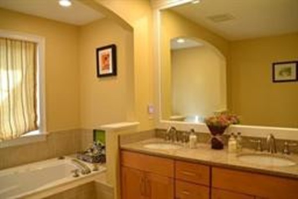 3 Indian Woods Way, Unit 3 Canton, MA 02021 - Photo 8 of 10 a bathroom with a tub sink and mirror