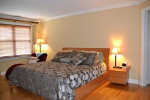 3 Indian Woods Way, Unit 3 Canton, MA 02021 - Photo 9 of 10 a bed sitting in a bedroom next to a window