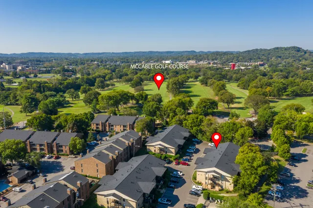 a front view of a building with garden