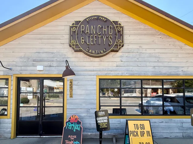 a front view of building with yard