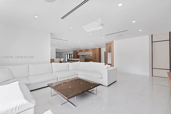 a view of a livingroom with an empty space and a window