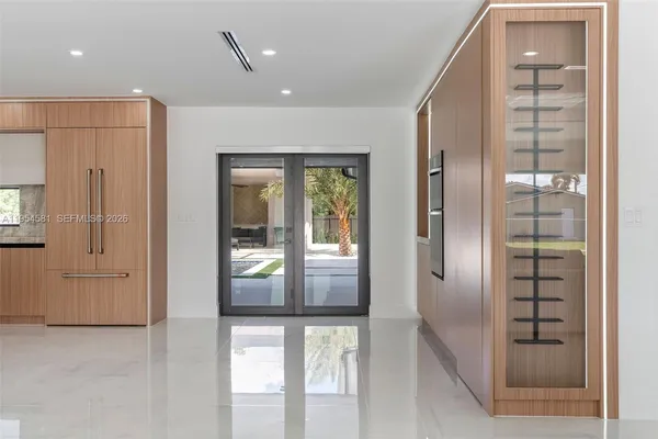 a living room with furniture and a ceiling fan
