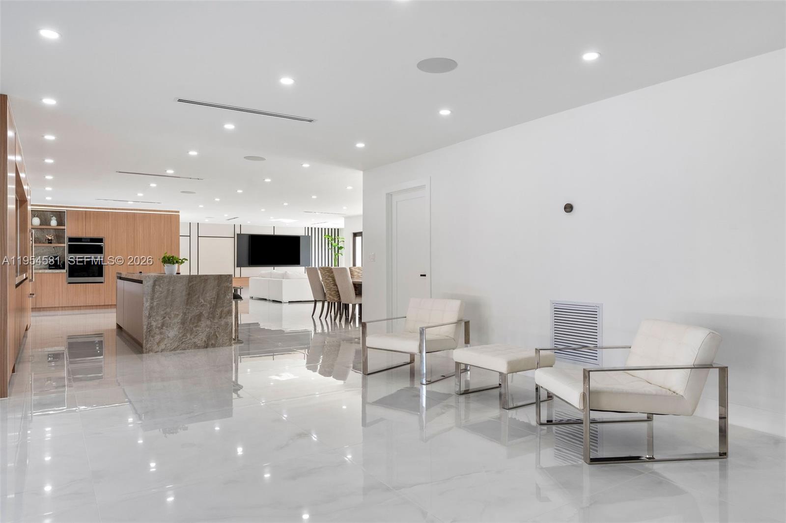 12425 Southwest 226th Street Miami, FL 33170 - Photo 25 of 75 a living room with furniture and a flat screen tv