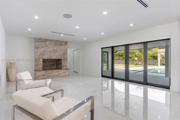 a kitchen with granite countertop a sink stainless steel appliances and cabinets